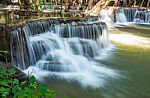 The Water Flowing Over Rocks And Trees Down A Waterfall At Huay Mae Khamin Waterfall National Park ,kanchana Buri In Thailand Stock Photo