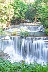 The Water Flowing Over Rocks And Trees Down A Waterfall At Huay Mae Khamin Waterfall National Park ,kanchana Buri In Thailand Stock Photo