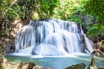 The Water Flowing Over Rocks And Trees Down A Waterfall At Huay Mae Khamin Waterfall National Park ,kanchana Buri In Thailand Stock Photo