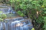 The Water Flowing Over Rocks And Trees Down A Waterfall At Huay Mae Khamin Waterfall National Park ,kanchana Buri In Thailand Stock Photo