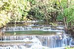 The Water Flowing Over Rocks And Trees Down A Waterfall At Huay Mae Khamin Waterfall National Park ,kanchana Buri In Thailand Stock Photo