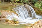 The Water Flowing Over Rocks And Trees Down A Waterfall At Huay Mae Khamin Waterfall National Park ,kanchana Buri In Thailand Stock Photo