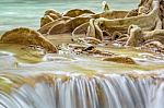 The Water Flowing Over Rocks And Trees Down A Waterfall At Huay Mae Khamin Waterfall National Park ,kanchana Buri In Thailand Stock Photo