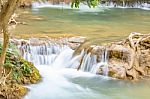 The Water Flowing Over Rocks And Trees Down A Waterfall At Huay Mae Khamin Waterfall National Park ,kanchana Buri In Thailand Stock Photo