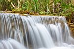 The Water Flowing Over Rocks And Trees Down A Waterfall At Huay Mae Khamin Waterfall National Park ,kanchana Buri In Thailand Stock Photo