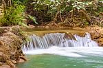 The Water Flowing Over Rocks And Trees Down A Waterfall At Huay Mae Khamin Waterfall National Park ,kanchana Buri In Thailand Stock Photo