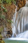 The Water Flowing Over Rocks And Trees Down A Waterfall At Huay Mae Khamin Waterfall National Park ,kanchana Buri In Thailand Stock Photo