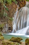 The Water Flowing Over Rocks And Trees Down A Waterfall At Huay Mae Khamin Waterfall National Park ,kanchana Buri In Thailand Stock Photo