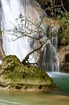 The Water Flowing Over Rocks And Trees Down A Waterfall At Huay Mae Khamin Waterfall National Park ,kanchana Buri In Thailand Stock Photo