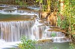 The Water Flowing Over Rocks And Trees Down A Waterfall At Huay Mae Khamin Waterfall National Park ,kanchana Buri In Thailand Stock Photo