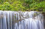 The Water Flowing Over Rocks And Trees Down A Waterfall At Huay Mae Khamin Waterfall National Park ,kanchana Buri In Thailand Stock Photo