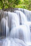 The Water Flowing Over Rocks And Trees Down A Waterfall At Huay Mae Khamin Waterfall National Park ,kanchana Buri In Thailand Stock Photo