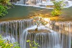 The Water Flowing Over Rocks And Trees Down A Waterfall At Huay Mae Khamin Waterfall National Park ,kanchana Buri In Thailand Stock Photo