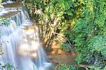 The Water Flowing Over Rocks And Trees Down A Waterfall At Huay Mae Khamin Waterfall National Park ,kanchana Buri In Thailand Stock Photo