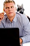 Thinking Man With Laptop And Pencil Stock Photo