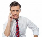 Thinking Young Businessman Stock Photo