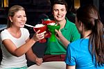 Three Friends Raises Ice Cream Cup Stock Photo