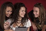 Three Young Girls With Tablet Pc Stock Photo