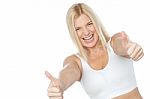 Tilted Image Of Cheerful Lady Showing Thumbs Up Stock Photo