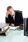 Tired Businessman At Work Place Stock Photo