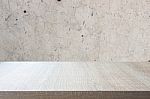 Top Of Wood Table On Old Concrete Wall Background Stock Photo