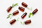 Top View, Bottle Of Essential Oil With Herbs Stock Photo