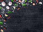 Top View Of Food Ingredients And Condiment On The Table, Ingredients And Seasoning On Dark Wooden Floor Stock Photo