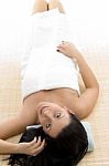 Top View Of Resting Woman Looking At Camera Stock Photo