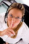 Top View Of Service Provider Instructing To Be Silent Stock Photo