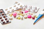 Top View Of The Pills On The White Background, Pack Of Tablet Drug And Capsule Pills On The Floor Stock Photo