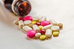 Top View Of The Pills On The White Background, The Drug And Capsule Pills On The Floor Stock Photo