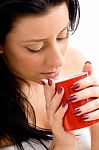 Top View Of Woman Holding Coffee Mug Against White Background Stock Photo