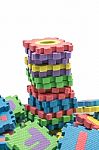 Tower Of Colorful Alphabet Puzzle Mat Isolated In White Backgrou Stock Photo