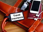 Travel Insurance Tag On Travel Bag Stock Photo