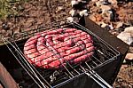 Travel Kielbasa Cooking. Uncooked Sausages Stock Photo