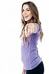 Trendy Girl Pointing Towards You Stock Photo