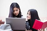 Two Asia Thai High School Student Uniform Best Friends Beautiful Girl Using Her Laptop Stock Photo