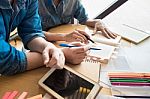 Two Asian Students Studying Together At University Stock Photo