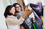 Two Beautiful Girls Shopping In A Clothes Shop Stock Photo