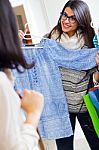 Two Beautiful Girls Shopping In A Clothes Shop Stock Photo