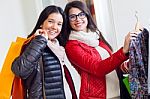 Two Beautiful Girls Shopping In A Clothes Shop Stock Photo