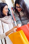 Two Beautiful Girls Shopping In A Clothes Shop Stock Photo