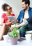 Two Business People Using A Digital Tablet At Office Stock Photo