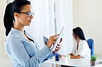 Two Business Woman Working In Office With Digital Tablet Stock Photo