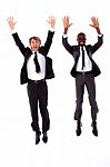 Two Businessmen Jumping Stock Photo