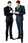 Two Businessmen Using The Phone Stock Photo