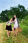 Two Girls Getting Ready For A Picnic Stock Photo