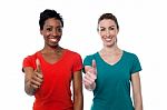 Two Happy Women With Thumbs Up Stock Photo