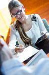 Two Pretty Business Women Working In The Office Stock Photo