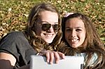 Two Women And Tablet Pc Stock Photo